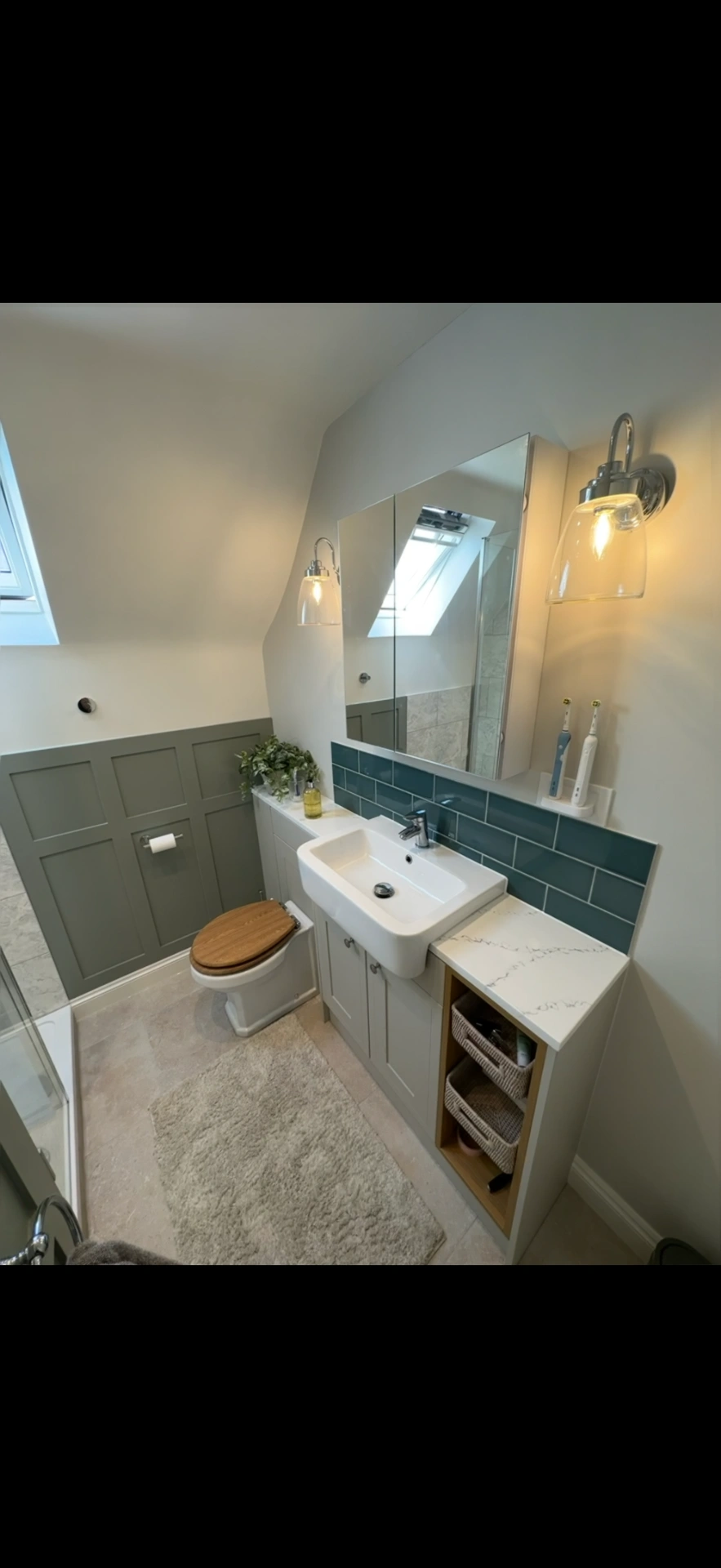 Loft cloakroom with sage panelling, teal tiles and fitted vanity — Basingstoke bathroom installers