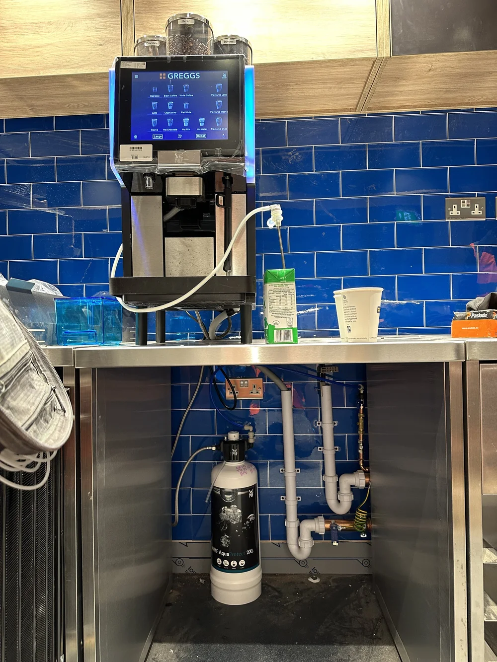 Commercial coffee machine with under-counter water filter and neat plumbing — plumber Basingstoke