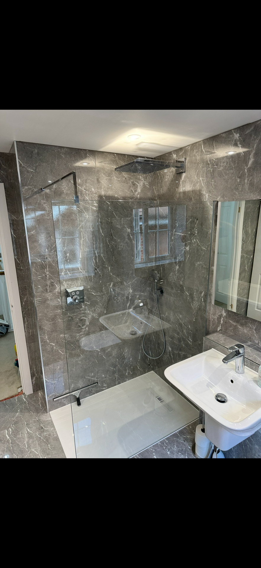 Grey marble walk-in shower with rainfall head and frameless glass — wet room Basingstoke