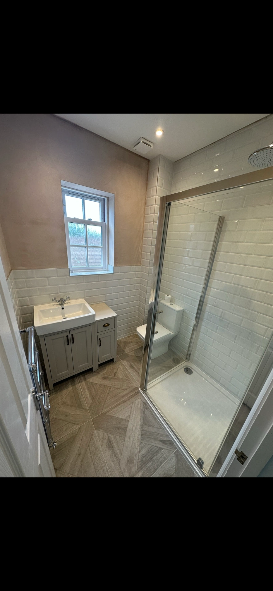 Traditional cloakroom shower room with grey shaker vanity, metro tiles and parquet floor — bathroom renovation Basingstoke