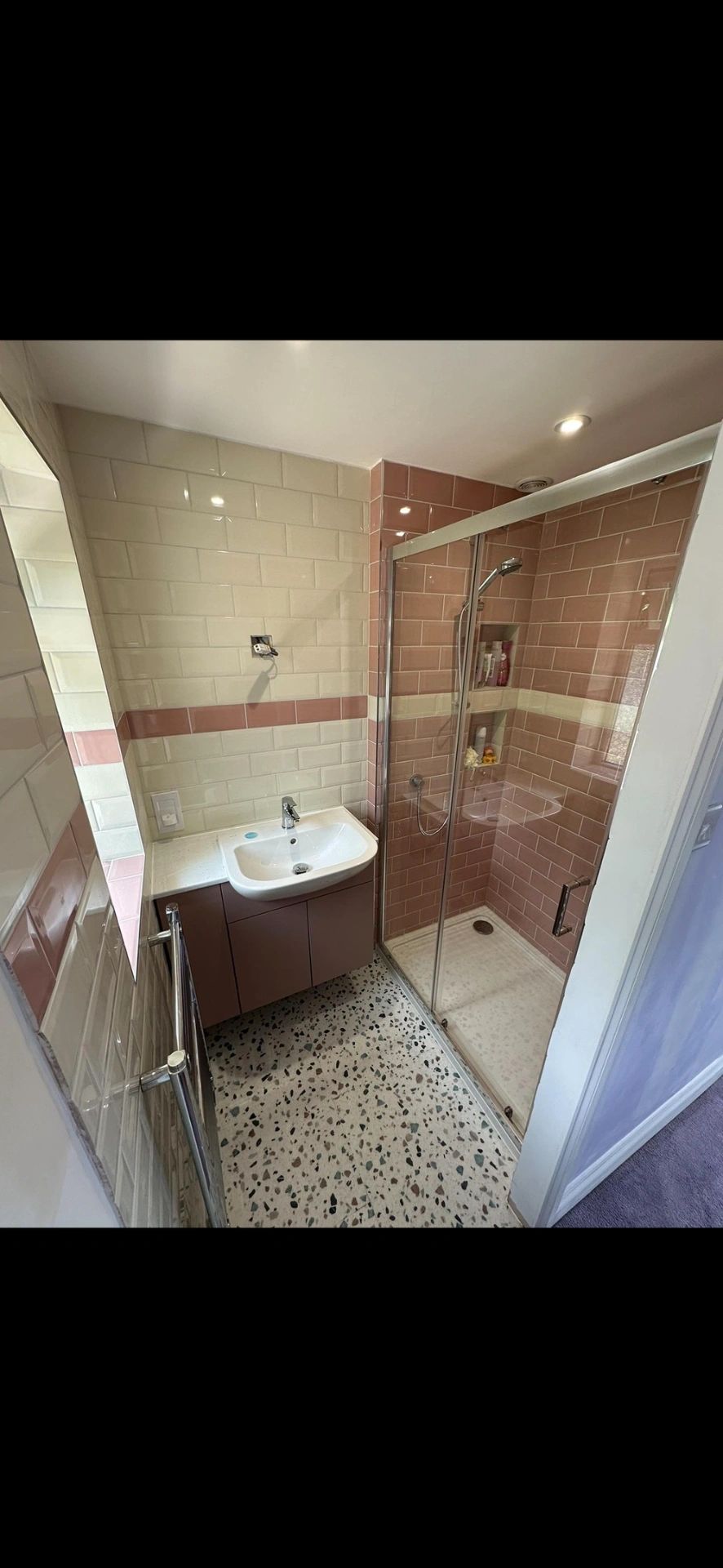 Pink and cream metro-tiled shower room with terrazzo floor — bathroom renovation Basingstoke