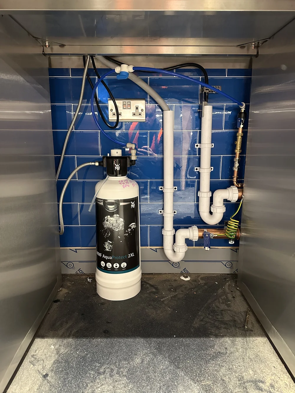Under-counter WMF AquaProtect water filter and plumbed connections — commercial plumbing Basingstoke